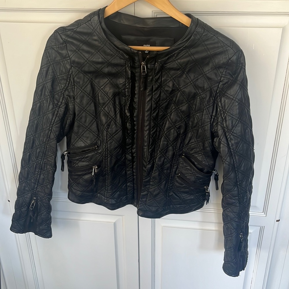 Faux leather quilted jacket. Super cute & rich looking.